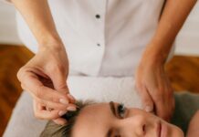 A young woman undergoing acupuncture therapy