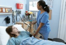 How to Develop Leadership Skills in Your Nursing Career A nurse attending to a patient inside a hospital room | nursing concept