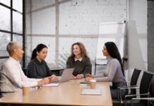 Ways to Support Women’s Mental Health at Your Workplace Women in an office meeting | Women's Mental Health Concept