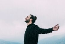 Man with open arms outdoors | Healing power of forgiveness concept