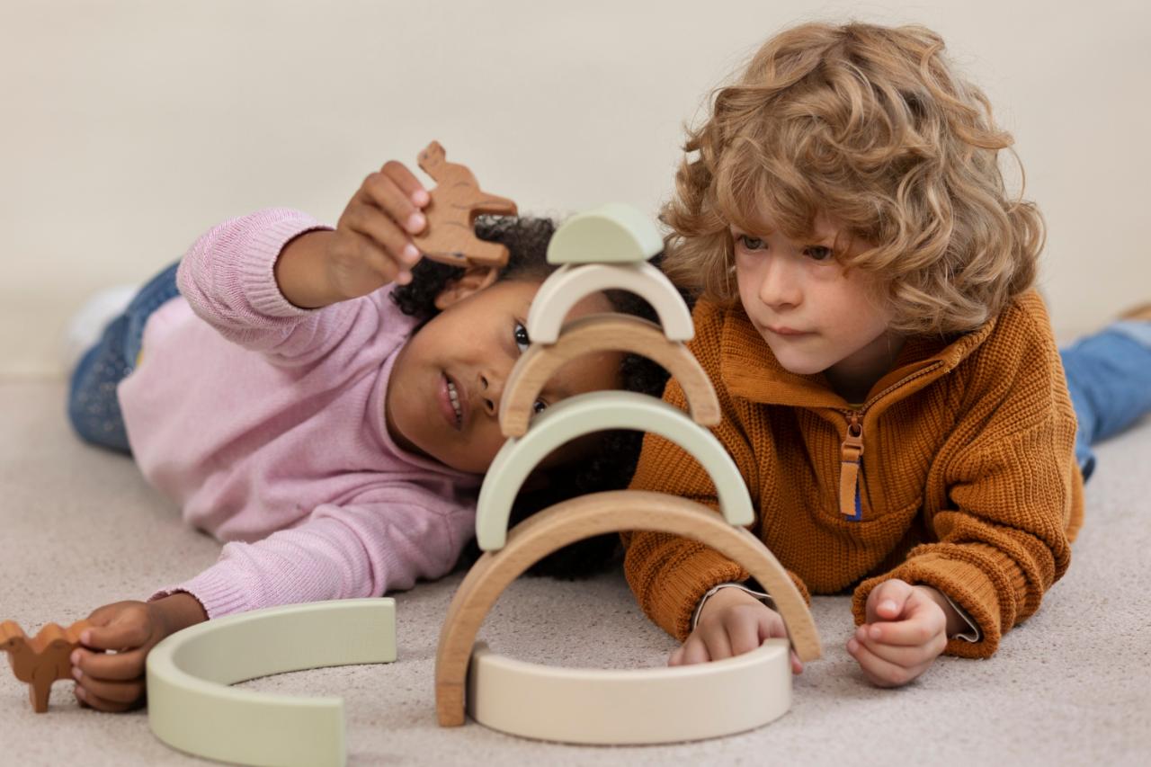 Toddlers playing with wooden toy | Concept for Neurodiverdent Children